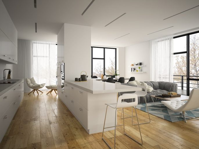 nowoczesny salon z aneksem kuchennym z wyspą i wyraźnym podziałem stref